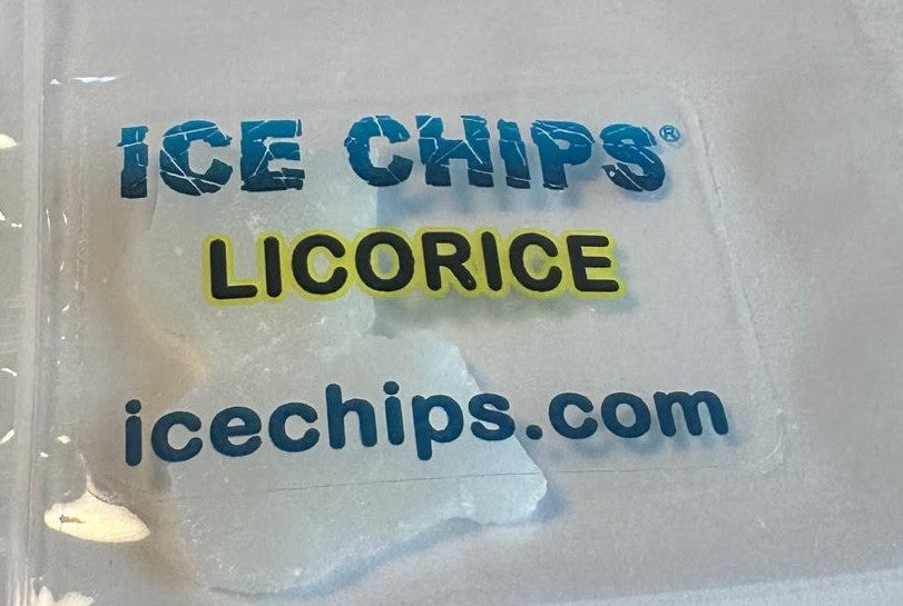 A close-up of a clear plastic bag containing ice chips, with blue and yellow text reading 'ICE CHIPS LICORICE' and 'icechips.com' on the front.