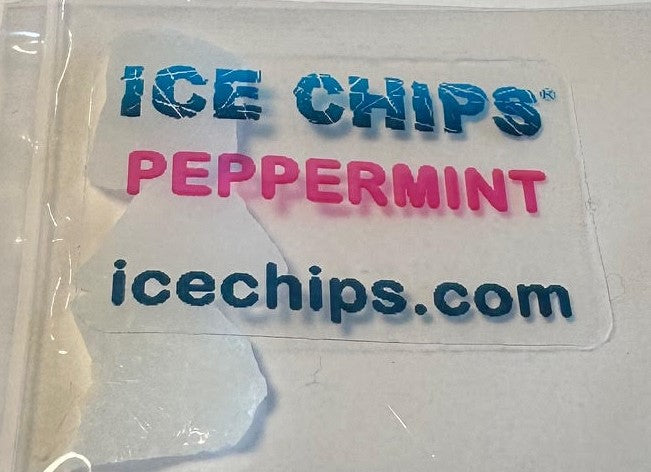 A clear plastic bag containing white ice chips with a printed label that reads 'ICE CHIPS PEPPERMINT' and 'icechips.com' in blue and pink text.
