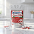 A stand-up pouch of Ice Chips Candy Cane sweetener powder, styled on a marble surface with candy canes, ice cubes, and a soft kitchen background.