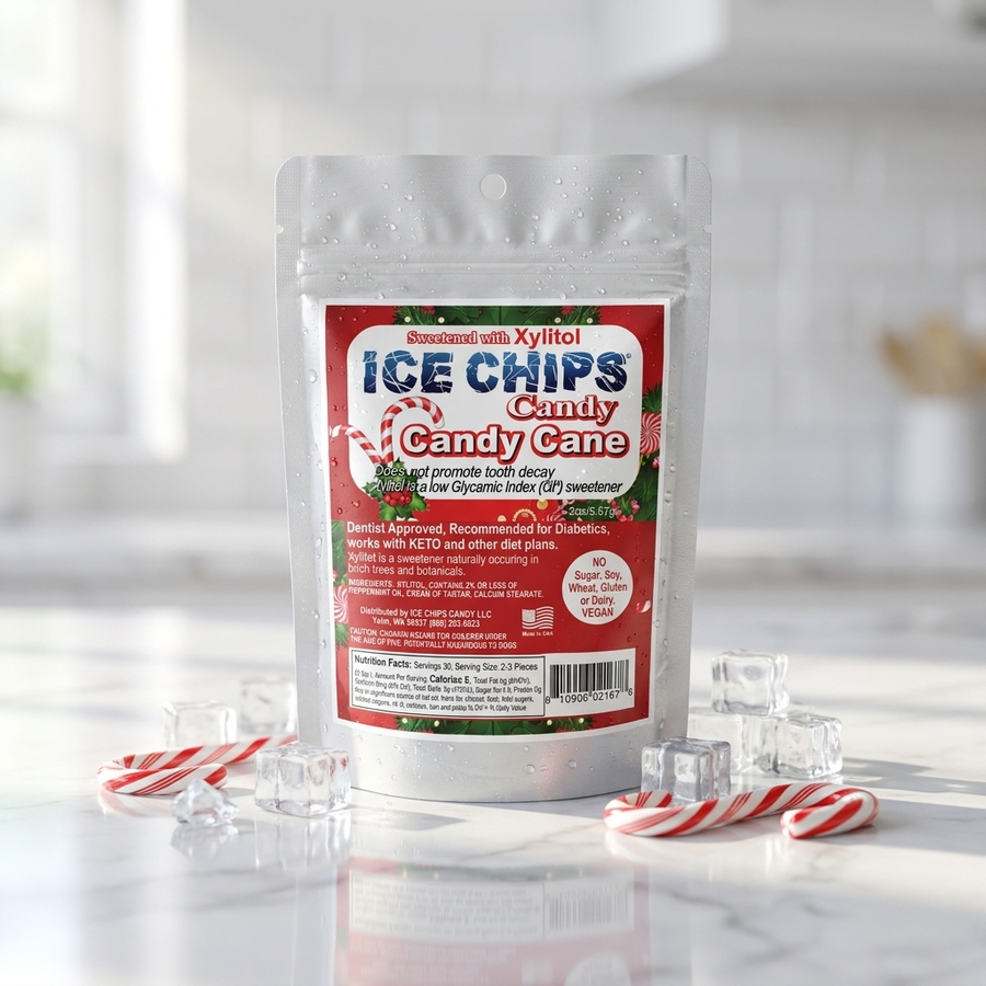 A stand-up pouch of Ice Chips Candy Candy Cane flavor, styled on a marble surface with candy canes, ice cubes, and a soft kitchen background.