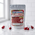 A stand-up pouch of Ice Chips Candy Cranberry flavor, surrounded by scattered cranberries and clear ice cubes on a glossy white surface with a white subway tile wall in the background.