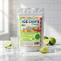 A stand-up pouch of Ice Chips Candy Margarita flavored Xylitol Candy, surrounded by lime slices, ice cubes, and a margarita glass on a marble surface with a white tiled background.
