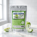 A stand-up pouch of Ice Chips Candy Sour Apple Candy sits on a white marble surface with ice cubes and sliced green apples around it. The pouch has a silver body with a large green front label.